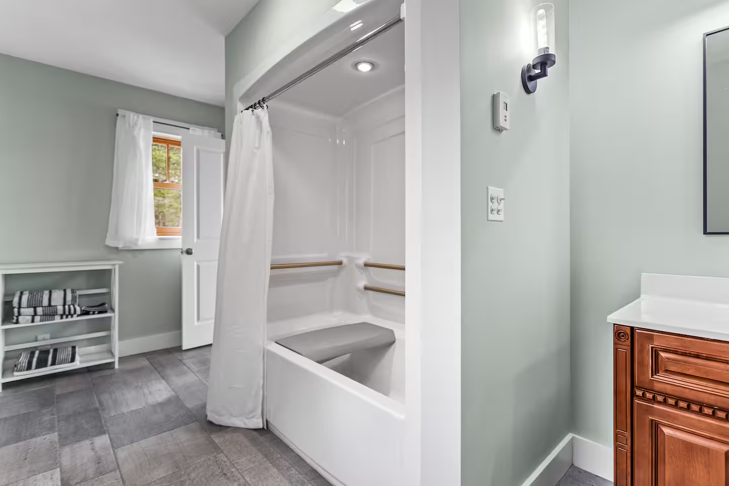Remodeled bathroom with tiled tub and shower